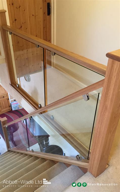 An Abbott Wade Oak Staircase With Glass Balustrade Installed On