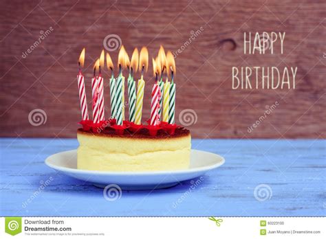 Text Happy Birthday And Cheesecake With Lighted Candles Stock