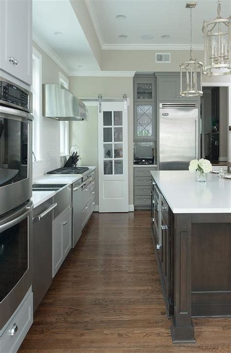 A vintage scheirich kitchen cabinet. Walk In pantry with Glass Door on Rails - Transitional - Kitchen