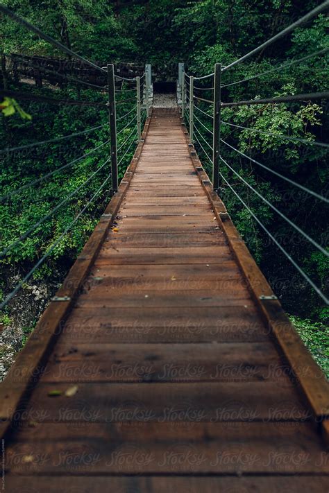 Wooden Bridge Across A Mountain River By Stocksy Contributor Blue