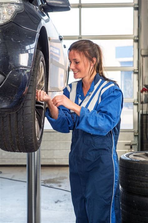 Female Mechanic Replacing Vehicle Tyres Stock Photo Image Of Skilled