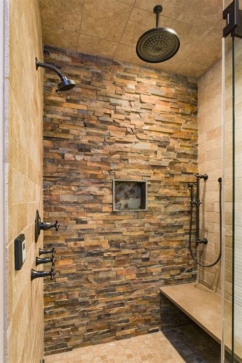 Amazing Stone Work In This Bathroom With Multiple Shower Heads And A