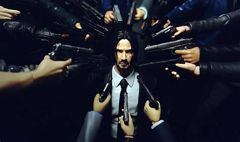John Wick Surrounded By Guns In The Opening Sequence Of John Wick