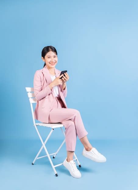 Premium Photo Young Asian Business Woman Sitting On Background