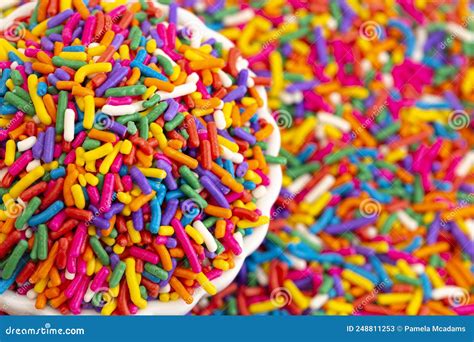 A Bowl Of Rainbow Sprinkles On A Table Of Sprinkles Stock Image Image