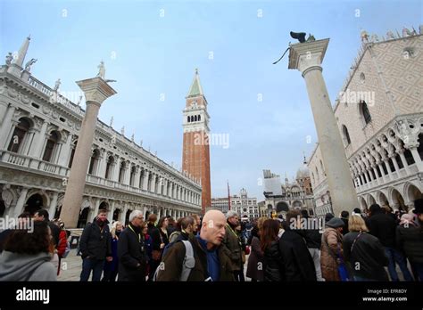 People Walking And Sightseeing On San Marco Square In Front Of Columns