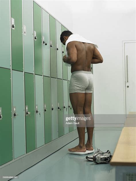 Man Standing On Scales In Locker Room Rear View Photo Getty Images