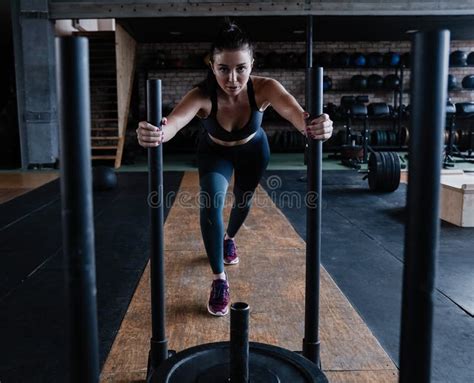 Fit Female Athlete Working Out In The Gym Crossfit Woman Exercising