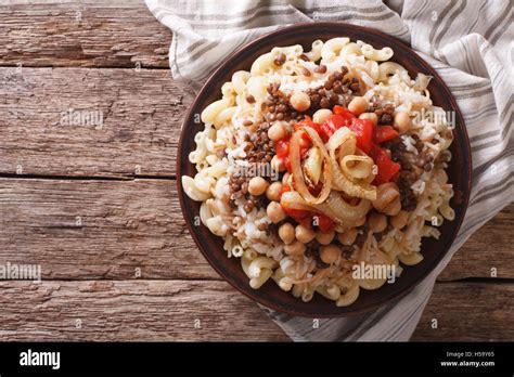 Arabic Cuisine Kushari Of Rice Pasta Chickpeas And Lentils On A