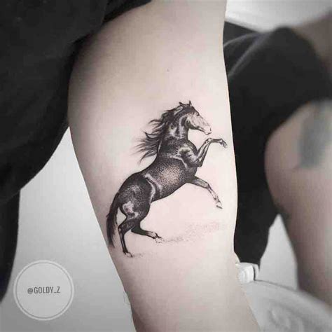 A Black And White Photo Of A Horse On The Left Arm With Its Tail In