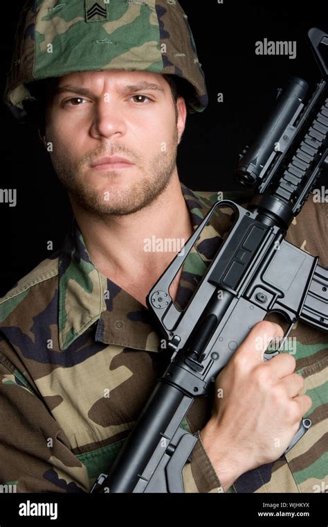 Soldier Carrying Machine Gun Stock Photo Alamy