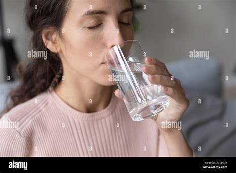 Close Up Beautiful Young Woman Drinking Pure Mineral Water Stock Photo