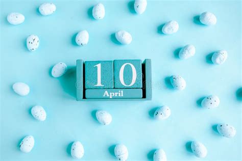 April 10 Blue Cube Calendar With Month And Date On Blue Background