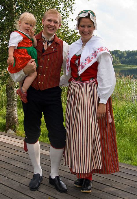 swedish svenska folkdräkter the woman wears a skedevidräkt from Östergötland folklore