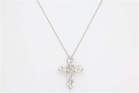 14 Karat White Gold 18″ Cross Necklace With 6 Shared Prong Set Round