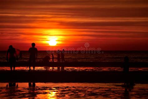 Sunset At The Beautiful Beach View Among The Many People Stock Photo
