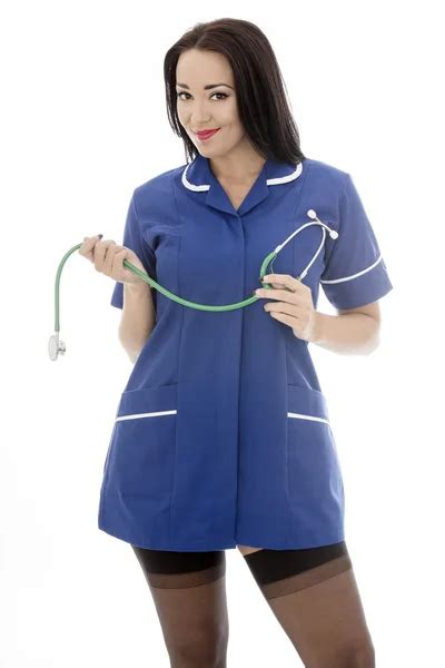 Sexy jeune pin up modèle portant une infirmière uniforme dans pin up glamour image libre de