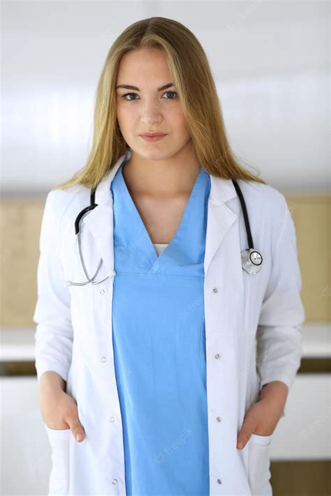 premium photo doctor woman at work while standing straight in hospital or clinic blonde