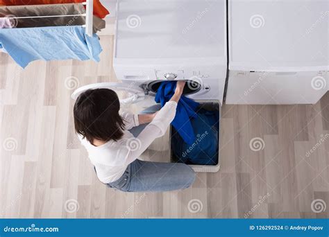 Woman Putting Dirty Cloth Into Washing Machine Stock Photo Image Of