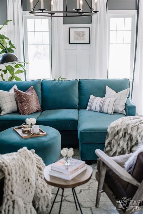 Eclectic Living Room With Teal Velvet Sofa Brown Leather Chairs And
