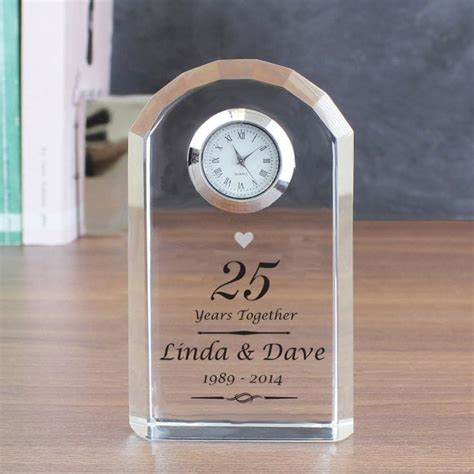 Evoking water, ribbons of silver flow around the wrist in a shining braid. Personalised Silver Wedding Anniversary Clock | Find Me A Gift