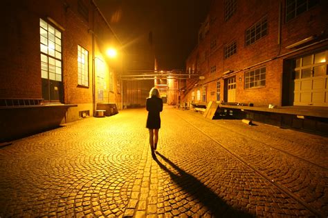 Back View Of A Woman Walking On Street At Night · Free Stock Photo