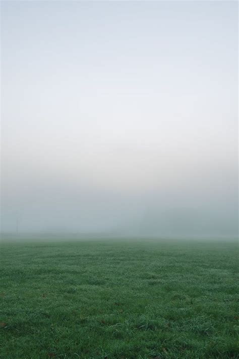 Selective Photography Of Green Grass Field Under White And Gray Sky