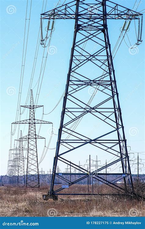 High Voltage Power Transmission Line Towers With Insulators On Which