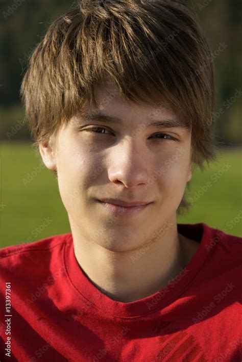 A Portrait Of A Handsome Teen Boy Outside Stock Photo Adobe Stock