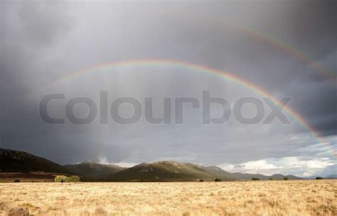 Dark Sky With A Rainbow Stock Image Colourbox