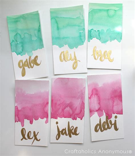 Splash a couple drops of water onto the front of your card where you will creating the watercolor effect. Craftaholics Anonymous® | DIY Watercolor Place Cards