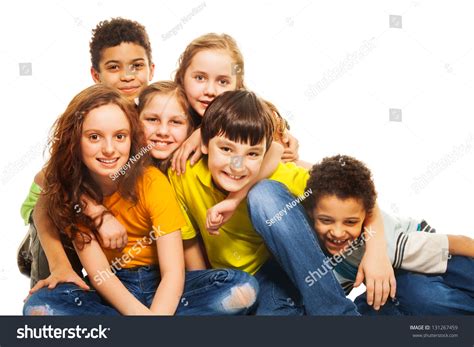 Group Of Diversity Looking Kids Boys And Girls Sitting On The Floor