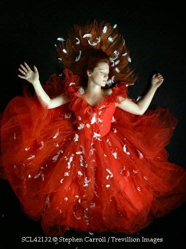 Trevillion Images Woman In Ballgown Covered In Feathers Photo Library Lady In Red Vintage