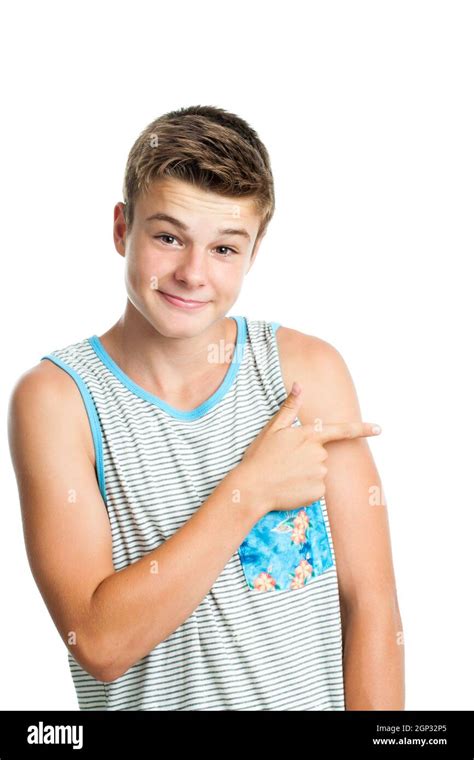 Close Up Portrait Of Attractive Teen Boy Pointing Aside With Finger