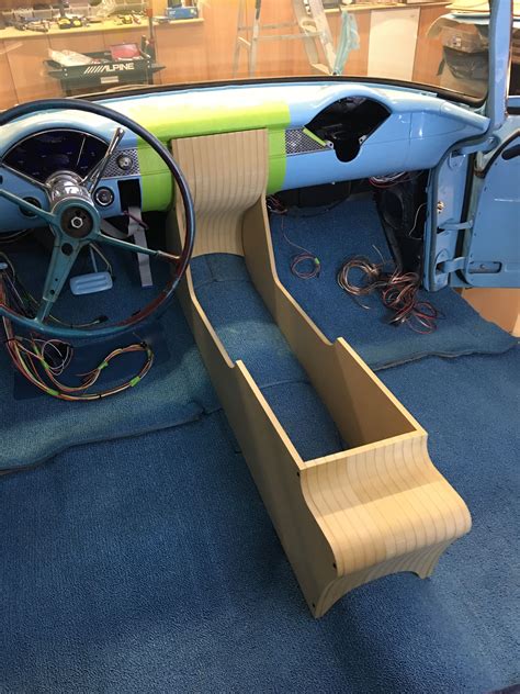 The Interior Of An Old Car With Steering Wheel And Dash Board In Its