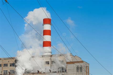 The Pipe Of The Industrial Plant Emits Toxic Smoke Into The Atmosphere And Air Pollution Of The