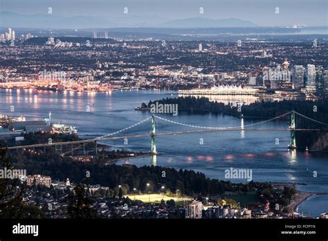 Burrard Inlet And The Lions Gate Bridge With The Background Of Downtown