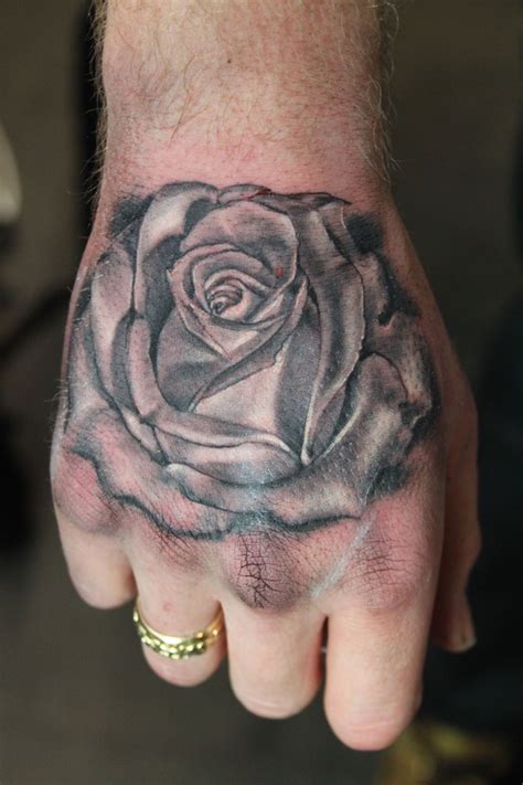 Black And Grey Rose Hand Tattoo Tattoo By Mirek Vel Stotker Rose