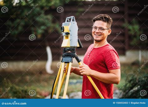 Survey Engineer Using And Working With Total Station Theodolite At