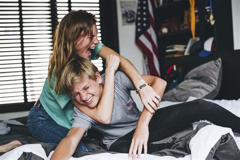 Brother And Sister Roughhousing In The Bedroom Premium Photo Rawpixel