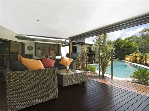 Indoor Outdoor Outdoor Living Design With Glass Balustrade And Ground