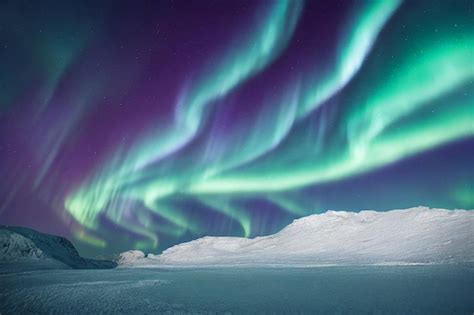 Premium Photo Northern Lights Over Snowy Mountains Aurora Borealis