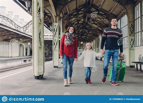 Shot Of Happy Family Going To Have Nice Trip During Holidays, Carry Bag, Walk On Railways ...