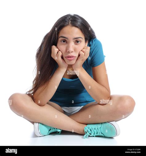 Bored Teenager Girl Sitting With Crossed Legs Isolated On A White Stock