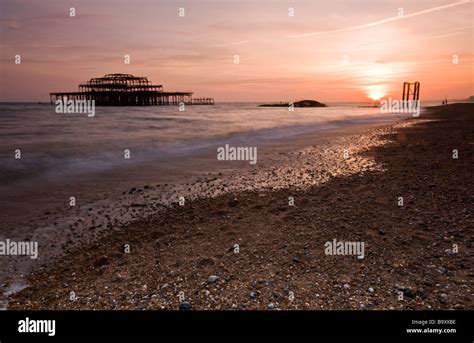 Sunset At Brighton East Sussex Looking Towards The Burnt Out Remains