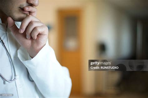Thoughtful Doctor With Hand On Chin High Res Stock Photo Getty Images