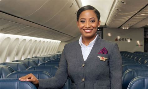 Delta Flight Attendant In Grey Uniform Onboard Aircraft Delta News Hub