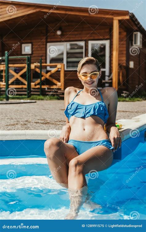 Beautiful Girl In Blue Swimsuit And Yellow Sunglasses Sitting Stock Image Image Of Swimsuit