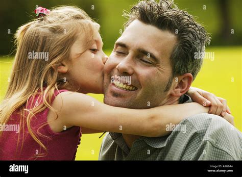 Daughter Kisses Father Stock Photo Alamy