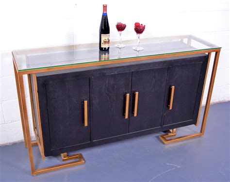 Wipe clean with a moist cloth. Black and gold cabinet - OIOS Metals